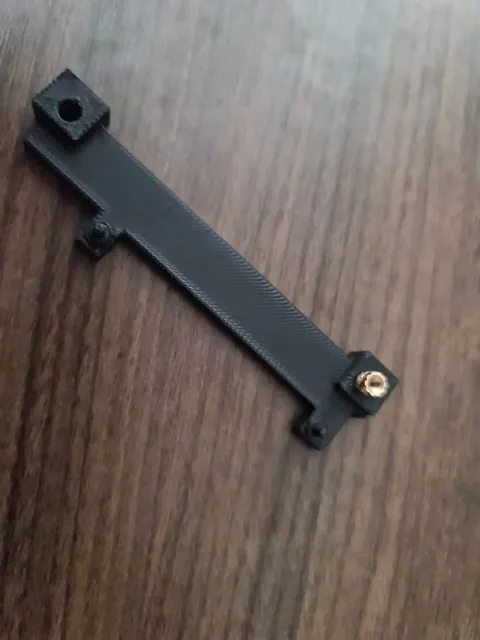 A bracket withe a brass insert.