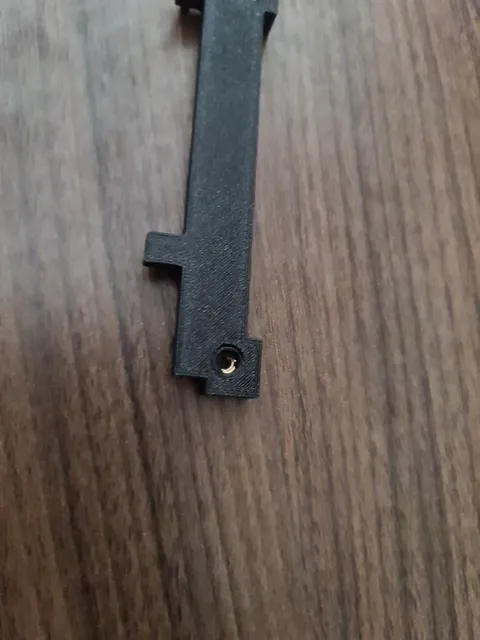 The inserted brass insert.