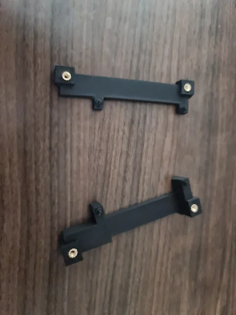 The completed brackets with the brass inserts.