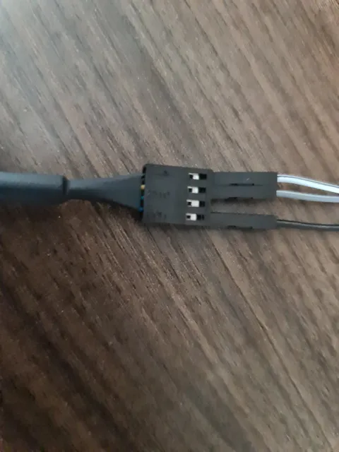 The jumper cables attached to the fan.